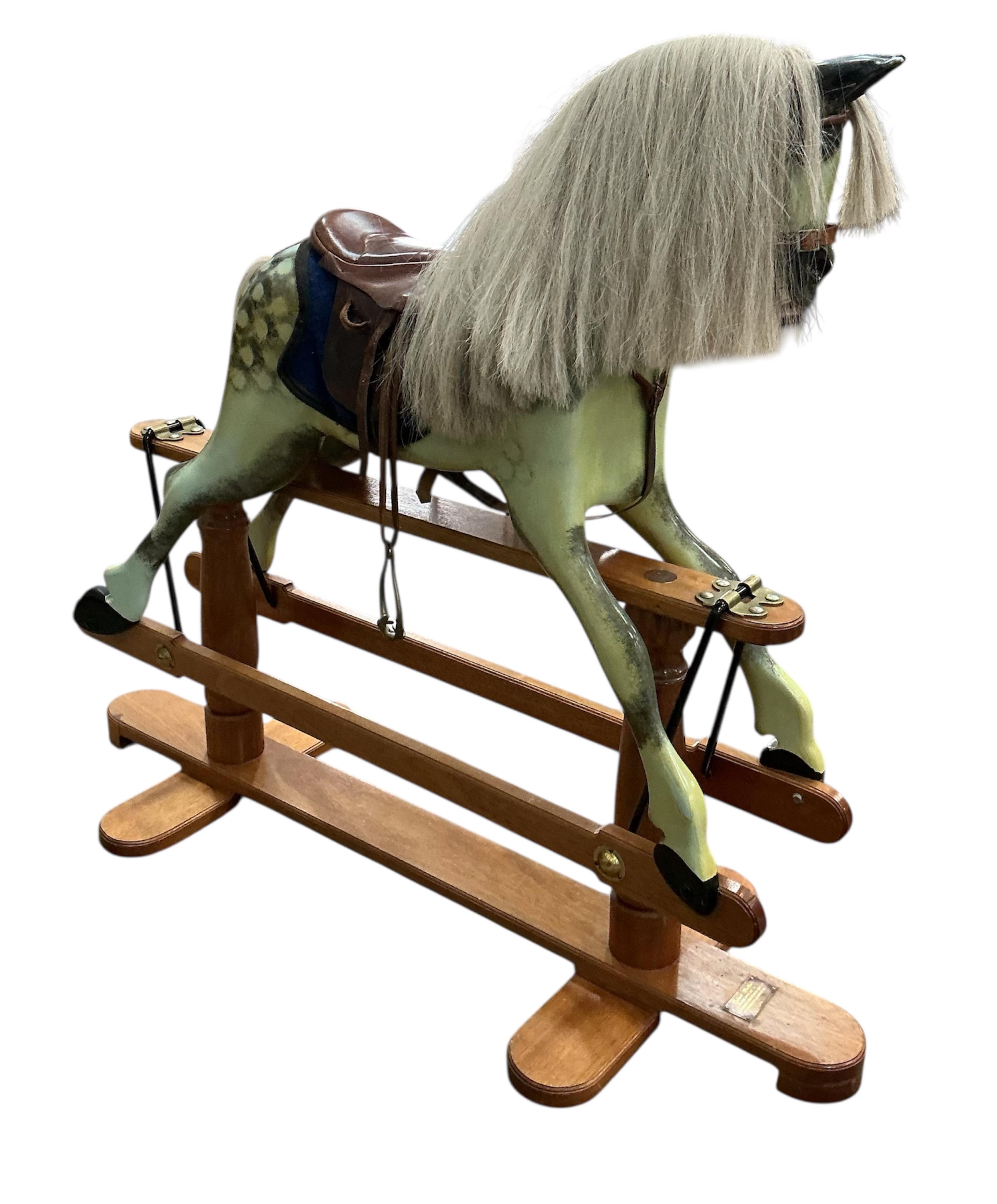A modern Robert Mullis of Swindon dapple grey rocking horse with tan leather tack on mahogany safety frame, height 116cm